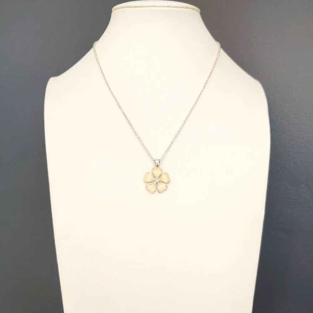 Cream flower pendant necklace with cz center and silver accents